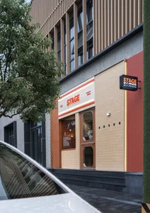 Modern retail storefront with tiled facade and signage
