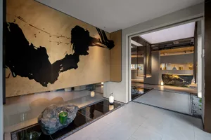 Minimalist design lobby featuring metallic finishes and sleek elements.