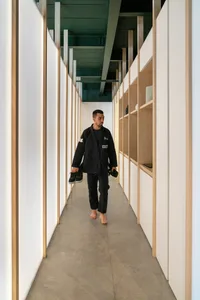 A minimalist design featuring exposed concrete walls and floor in an architectural interior space.