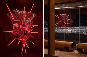 Modern interior design featuring metallic structures and neon lights.