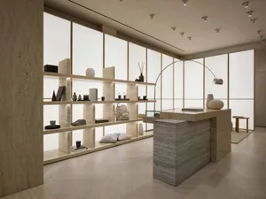 Luxurious retail storefront featuring modern stone shelves and minimalist design