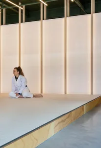 A minimalist space featuring wooden paneling