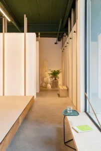 Modern workspace with minimalist design, featuring wood and concrete materials.