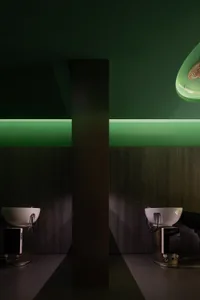 A modern salon interior with green accents and white sinks.