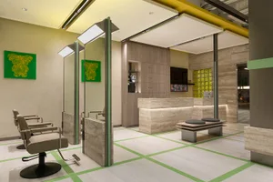 Modern, sleek and stylish salon interior with marble floors, concrete elements, and contemporary design.