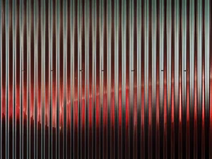 A vivid and dynamic abstract design featuring metallic hues and patterns.