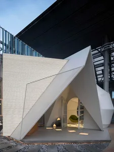 Modern architectural decoration featuring a metal structure in an outdoor setting.