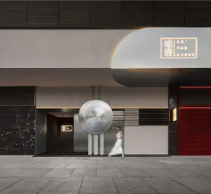 A modern Art Deco retail storefront featuring black and white materials.