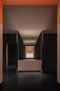 A modern interior with concrete walls and a minimalist design.