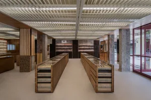 Modern retail storefront featuring prominently designed interior with solid wood finishes.