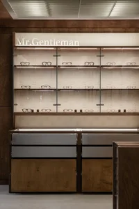 Display of glasses in a retail store with a modern design.