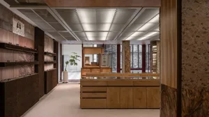 An interior photograph of a retail store featuring a wooden counter.