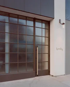 Modern entryway featuring glass panels and a minimalist design.