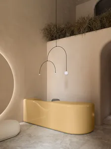 A sleek, modern reception desk made of polished, yellow concrete.