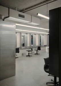 Modern minimalist hair salons with concrete floors and walls.