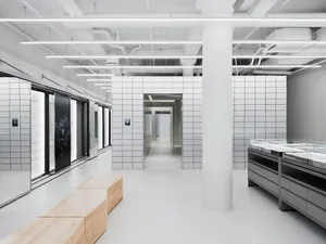 Modern retail storefront with concrete and tiled walls, minimalist design