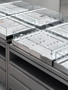 Glass display cases in a retail store showcasing jewelry