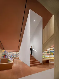 A modern retail store interior featuring wooden and light-colored concrete elements.