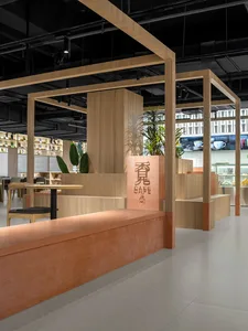 Modern interior design of a coffee shop featuring wooden and concrete materials.