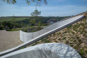 A modern landscape installation featuring concrete and gravel