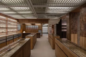 Modern retail space featuring wooden display cases for eyewear.