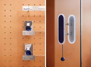 Retail store display case showcasing three bottles of fragrance with a modern and minimalist design.