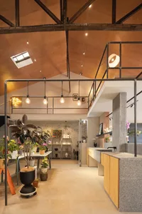 An industrial retail space featuring concrete walls and floors.