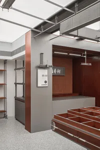 A modern retail store with metal shelves and a counter area.