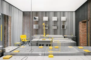 Industrial commercial kitchen with metal countertops and appliances