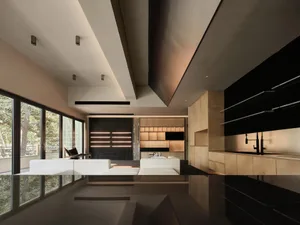 Modern, minimalist living space featuring black metallic cabinets and sleek, contemporary design elements.