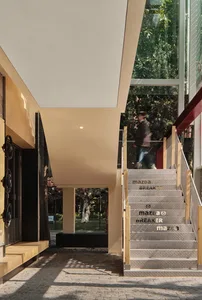 A modern minimalist staircase made of metal with the words 'mazda breaker' repeated on each step.