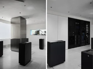 A modern office space featuring concrete and metal elements.