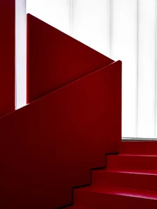 A red staircase with a contemporary design.