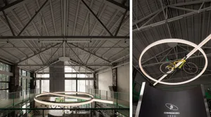 An industrial-style interior with circular metal structures and modern lighting fixtures.