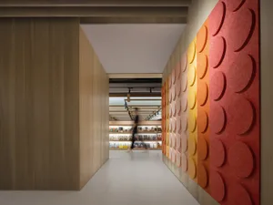 A minimalistic library featuring acoustic foam panels and wooden walls
