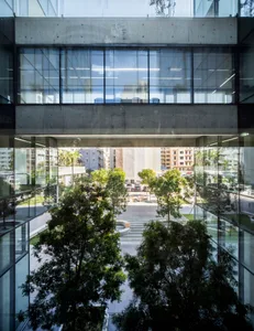 A modern building exterior featuring concrete and glass materials.