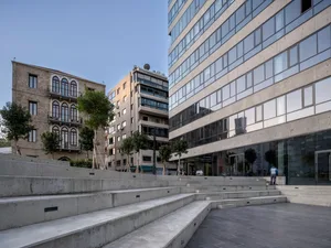 A modern cityscape featuring a building made of concrete.