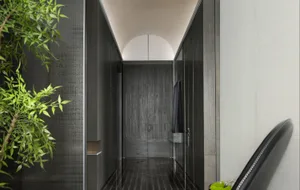 Modern entryway featuring wooden and concrete materials.