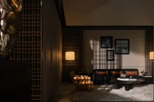 A modern residential living room with textured dark-colored panels on the walls and wooden furniture.