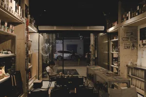 Industrial-style cafe interior with concrete walls and minimalist furniture