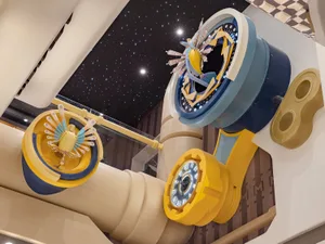 Large, metallic, industrial-themed interior structure featuring mechanical components and a starry ceiling.