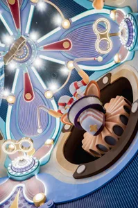 A futuristic, industrial playground structure featuring metallic components and vibrant lighting.