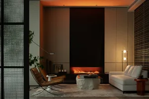Modern living room with a glass wall and a cozy fireplace, featuring a white sofa, woven armchairs, and a stone coffee table.