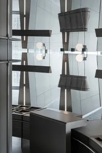 Industrial kitchen with metallic surfaces and geometric design elements.