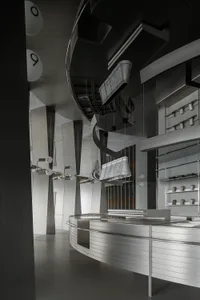 A futuristic modern retail storefront with metallic steel elements.