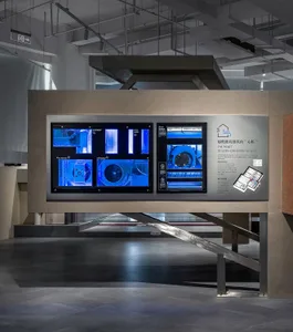 Industrial exhibition display featuring glass elements and blue lighting