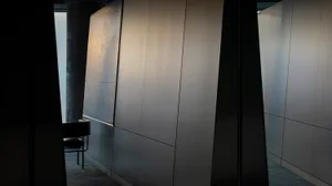 An office space featuring sleek, metallic panels.