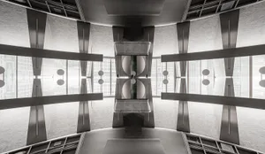A modern industrial office space with metal, glass, and concrete elements.