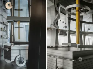 Industrial-style modern kitchen featuring metallic surfaces and minimalist design.