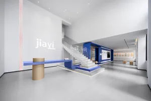 A modern office with blue and white stairs and a clean, minimalist design.